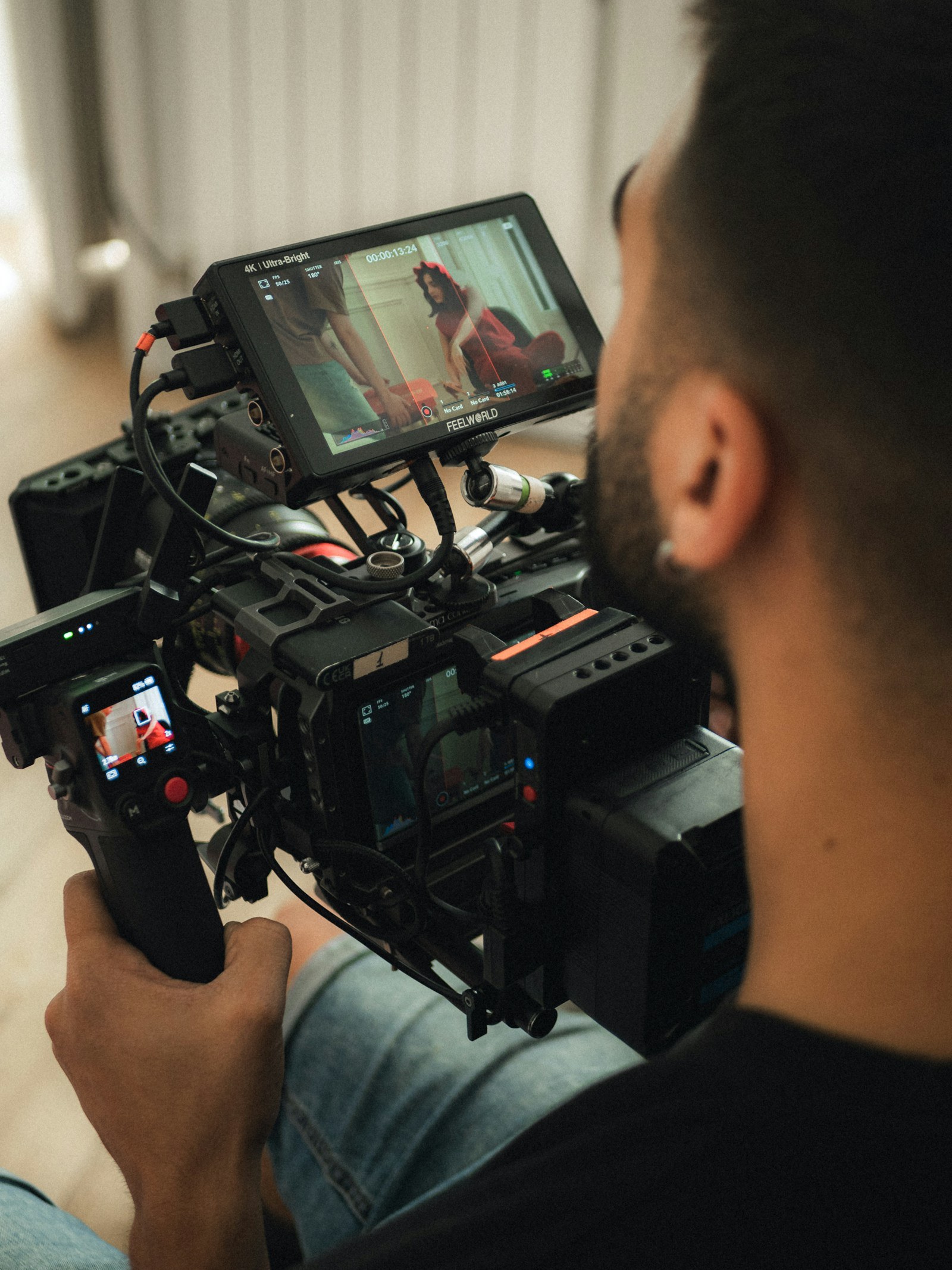 Illustrative professional camera operator filming with a video rig