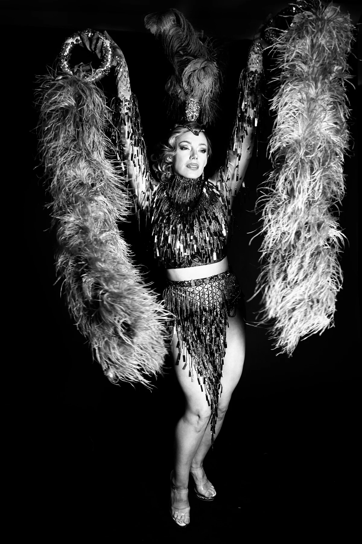 Puss-n-boots performing with feather fans